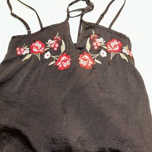 Black tank, straps go around shoulders and neck